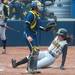 Iowa's Michelle Zeller slides in to home during the forth inning bringing the score to 2-0 in favor of Iowa.
Courtney Sacco I AnnArbor.com